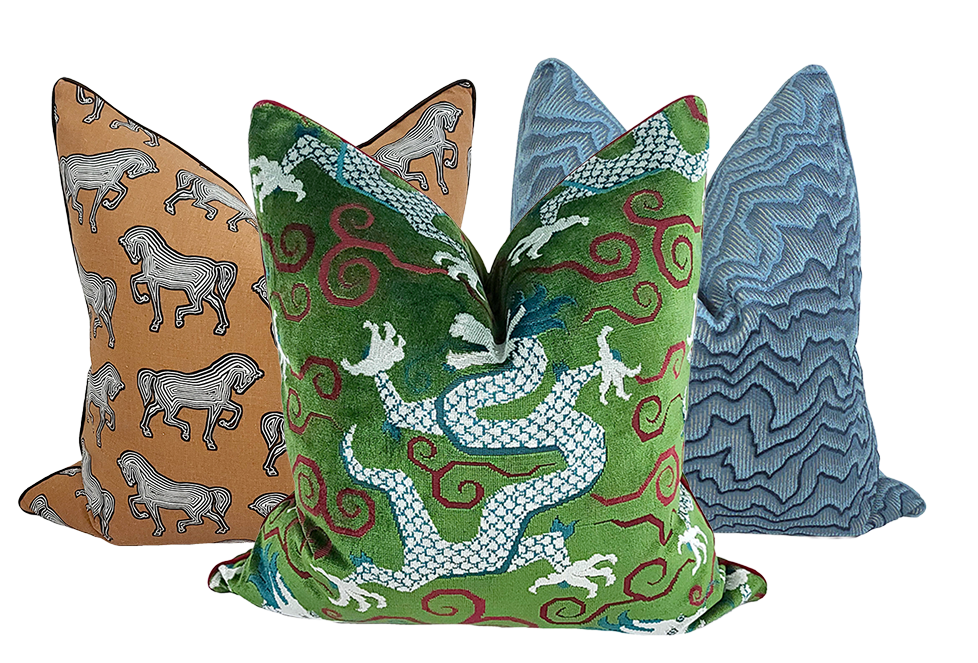 Three custom designed pillows with various patterns including horses and dragons